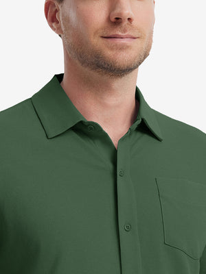 Model front view from nose to chest wearing dark green cotton blend plain shirt.