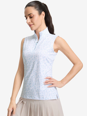 Front upper body shot of model wearing white blue florals women's sleeveless q-zip print quick dry golf tops