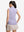 Back upper body shot of model wearing light purple white women's q-zip pin striped texture golf shirts