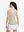 Back upper body shot of model wearing beige white women's q-zip pin striped texture golf shirts