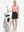 Front full body shot of model with golf gear wearing black women's stretch a-line golf skort with 7 pockets