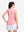 Back upper body shot of model wearing pink coral white women's q-zip pin striped texture golf shirts