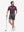 Front full body shot of model wearing iron grey flat front hybrid golf shorts