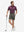 Front full body shot of model wearing tea brown flat front hybrid golf shorts