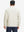 Back view of lightweight water-resistant outerwear jacket on model, showing beige design
