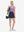 Front full body shot of model wearing navy high waist built-in short a-line golf skirt with 5 pockets