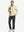 Full body model with bag, wearing water-resistant fleece lined pants in dark grey outdoors