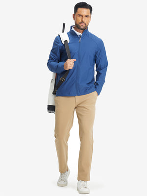 Full-body shot of model with golf bag on back wearing khaki water-resistant stretch heat-tech winter trousers