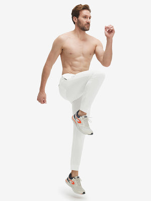 Model wearing white superion softness mesh joggers with zipper pockets
