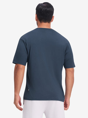 Back upper body view in dark blue heather of moisture wicking heather round neck athletic t-shirts.