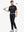 Full body front view of model wearing BLACK Water Resistant Everyday Pants, holding a golf club