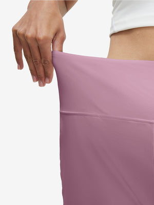 Detail view of elastic waistband on lavender pink women's high waist 2 in 1 quick dry shorts with 7 pockets