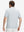 Back half-body view of a model wearing the navy feather weight jacquard polo shirts, highlighting the rear fit
