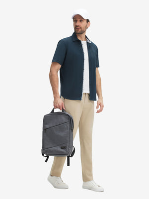 Front full body shot of model exercising in navy cool print plain button up shirts