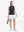 Front full body shot of model wearing navy blue women's moisture-wicking mock neck sleeveless golf tops