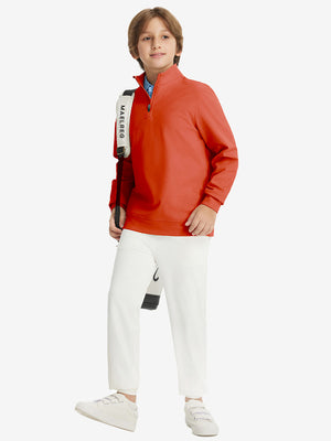 Youth Winter Micro-fleece Quarter Zip Pullover in orange, model wearing tennis bag, front view