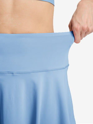 Detail view of skirt elasticity on light blue women's high waisted golf skirts with 4 inner pockets