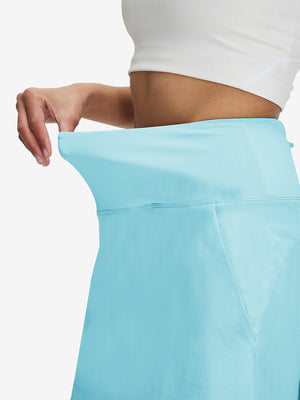 Detail view of elastic waistband on lake green women's stretch a-line golf skort with 7 pockets