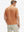 Back half body shot of model wearing orange adobe reflective performance reflective checked collar golf shirt