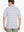 Back half-body view showing the relaxed fit of the Lavender White Yarn Dyed Stripe Polo