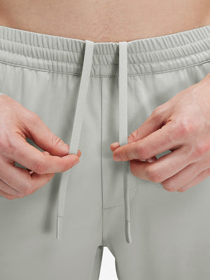 Detail view of elastic waistband on silver gray 4 way stretch breathable workout athletic shorts