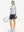 Front full body shot of model exercising in pink purple rose women's sleeveless q-zip print quick dry golf tops