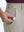 Detail view of front pocket on fossil flat front hybrid golf shorts