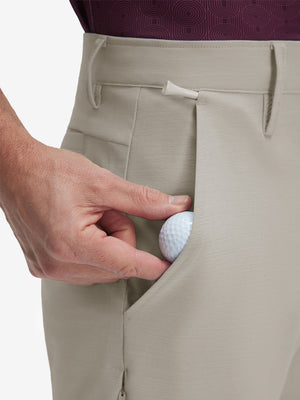 Detail view of front pocket on fossil flat front hybrid golf shorts