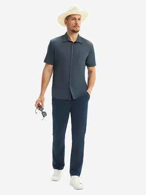 Front full body shot of model exercising in dark grey cool print plain button up shirts