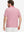Back upper body shot of model wearing pink small fish premium ribbed collar print polo shirts