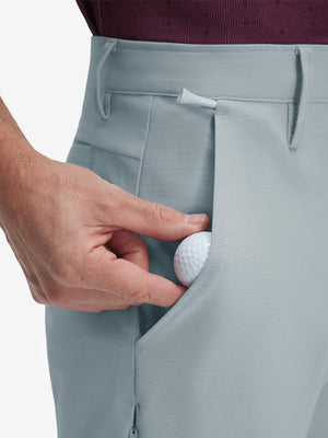 Detail view of front pocket on newport blue flat front hybrid golf shorts