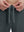 Close-up of elastic waistband on dark grey superion softness mesh joggers with zipper pockets