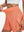 Detail view of elastic waistband on peach pink women's gym golf shorts with liner pocket