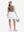 Front full body shot of model wearing mossy stone women's moisture-wicking mock neck sleeveless golf tops