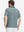 Back upper body shot of model wearing dark green oval premium ribbed collar print polo shirts
