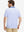 Back upper body shot of model wearing pink purple diamond premium ribbed collar print polo shirts