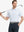 Model in WHITE/LIGHT BLUE STRIPE Polo swinging a golf club in motion-ready posture