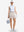 Front full body shot of model exercising in white blue florals women's sleeveless q-zip print quick dry golf tops