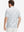 Back half-body of model in grey splatter stretch printed collarless henley golf shirts