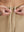 Detail view of elastic waistband on light khaki women's lightweight athletic sweatpants