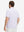 Front half-body view of a model wearing the lavender feather weight jacquard polo shirts, showing the chest pocket