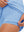 Inner side detail view in light blue of women's lightweight golf dress with 2 pockets.