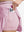 Detail view of inner pocket on light pink women's moisture-wicking athletic tennis skirts