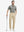 Full-body shot of a model holding a golf club, wearing the black feather weight jacquard polo shirts and pants