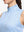 Detail view of neck zipper on blue plaid women's sleeveless q-zip print quick dry golf tops