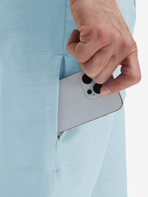 Detail view of side pocket on light blue straight fit lightweight dress golf pants