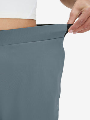 Detail view showing waist stretch on grey blue women's lightweight athletic sweatpants