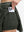 Detail view of inner pocket on army green women's moisture-wicking athletic tennis skirts