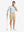 Front full body shot of model exercising in grey irregular shape premium ribbed collar print polo shirts
