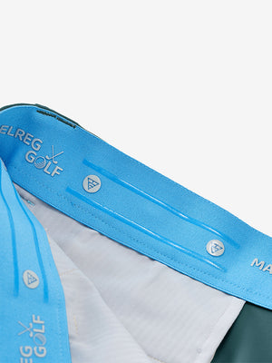Inside waistband detail of water-resistant golf stretch nylon pants featuring maelreg logo, dark teal.